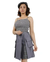 Woman in grey hybrid kilt with gingham pleats and cargo pocket, front view