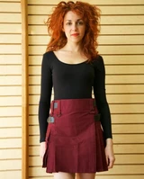 Woman in burgundy working kilt with side straps, front view