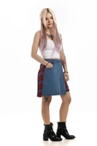 Woman in blue denim skirt with red tartan side pleats, three-quarter view