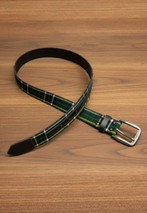 Black leather belt with dark green tartan inlay and silver buckle