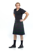Three-quarter view of man in Keith bespoke kilt in dark green and navy tartan