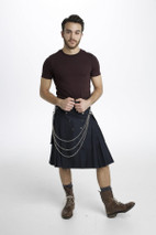 Man in black Luxe Utility Kilt with snap pockets and silver chains, front view