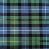 Close-up of navy and green tartan fabric with red and white lines for a bespoke kilt