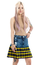 Woman in straight mini skirt of blue denim with yellow and black tartan hem, front