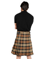 Man wearing a bespoke kilt in camel and black tartan, back view showing pleats