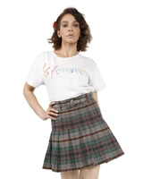 Pleated skirt in grey, green and red plaid with belt worn by a woman, front view