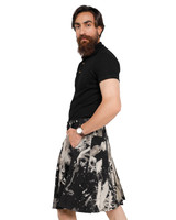 Man in black acid wash Nightfall denim kilt with hand in pocket, side view