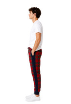 Side view of red plaid joggers showing the navy side stripe and cuffs