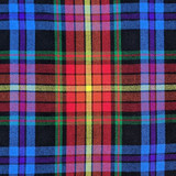 Close-up of bespoke kilt fabric in red and navy tartan with white lines