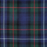 Close-up of navy and green tartan fabric with red and white lines for a bespoke kilt