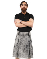 Man wearing a modern bespoke kilt in grey mottled fabric with side straps, front view