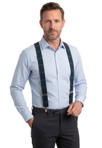 Man wearing tartan braces in dark green and navy with a light blue shirt, front view
