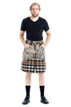 Full-length view of man in denim tartan kilt with hands in front pockets, black socks