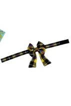 Yellow and black tartan dog bow tie on an adjustable strap