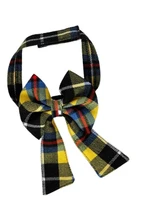 Close-up of yellow, black and blue tartan dog bow tie with long tails