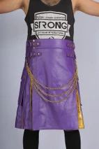 Close-up of purple leather hybrid kilt with chains, straps and gold pleats