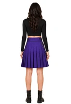 Back view of woman in purple pleated utility kilt with side chain