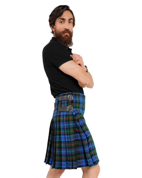 Man wearing a bespoke kilt in blue and green tartan, side view with buckle straps