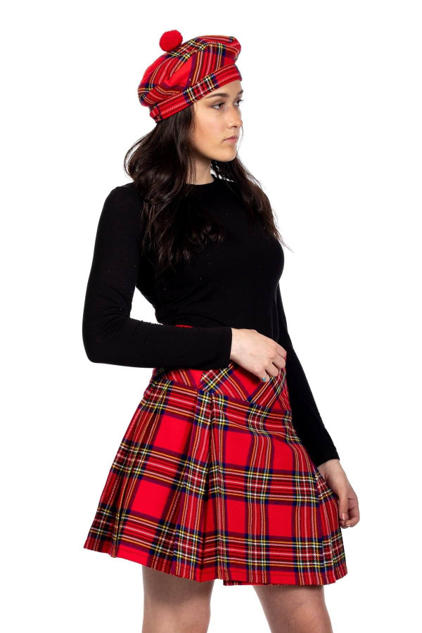 Woman in red tartan mini kilt with matching red tartan tam, side view