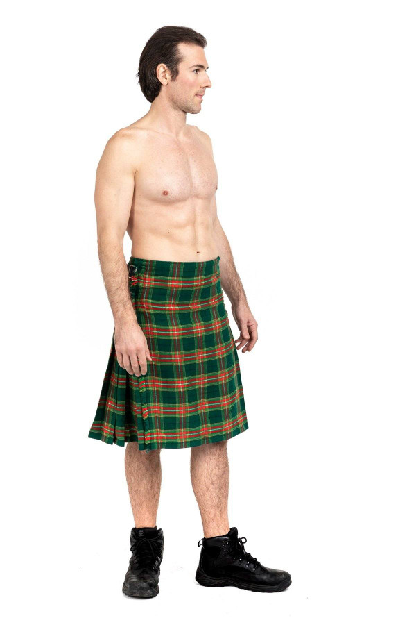 Gallagher bespoke kilt in green and orange tartan, side view worn with black boots