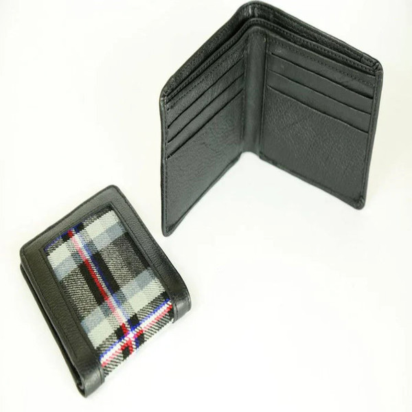 Black leather bifold wallet open beside a closed wallet with a grey, white and red tartan panel