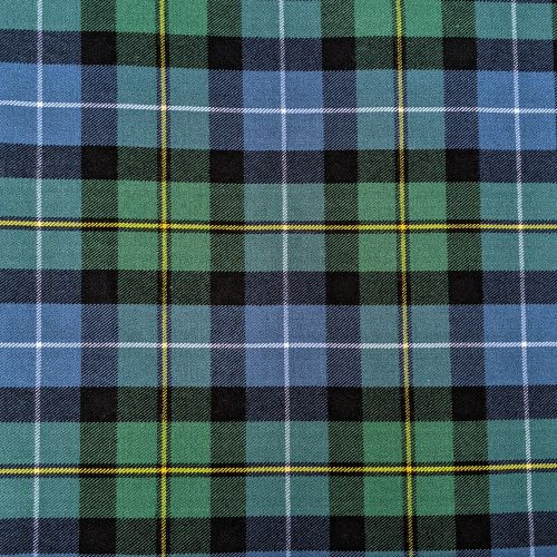 Close-up of navy and green tartan fabric with red and white lines for a bespoke kilt