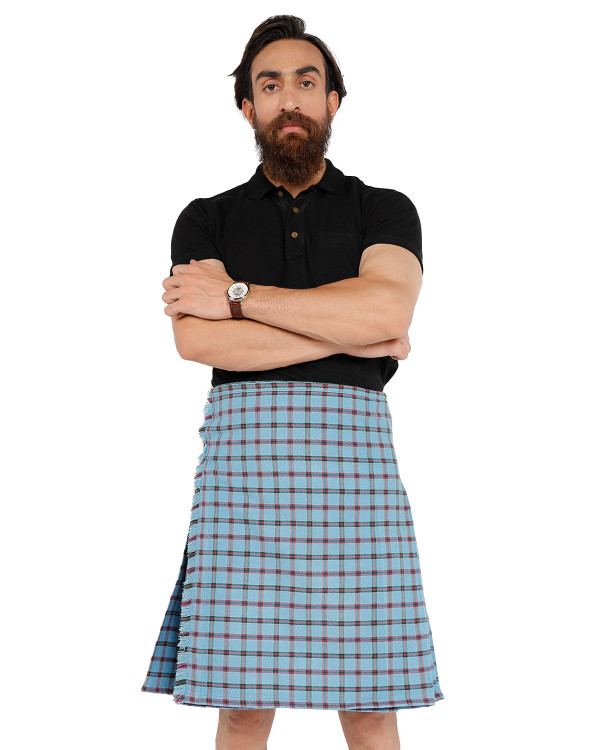 Man wearing a bespoke kilt in light blue tartan with red lines, arms crossed, front view