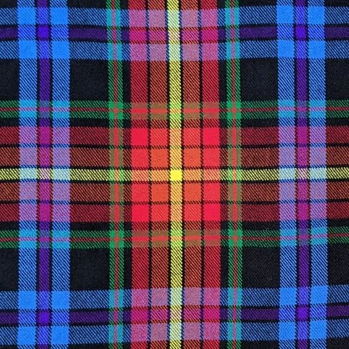 Close-up of bespoke kilt fabric in red and navy tartan with white lines