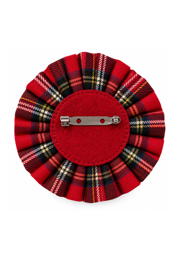 Back of a 3 buttons tartan brooch in red tartan, showing the red felt backing and pin