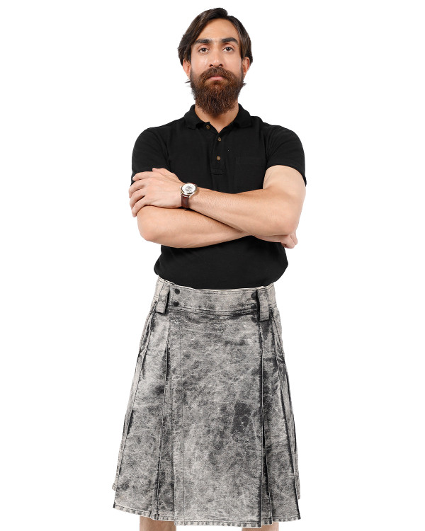 Man wearing a modern bespoke kilt in grey mottled fabric with side straps, front view