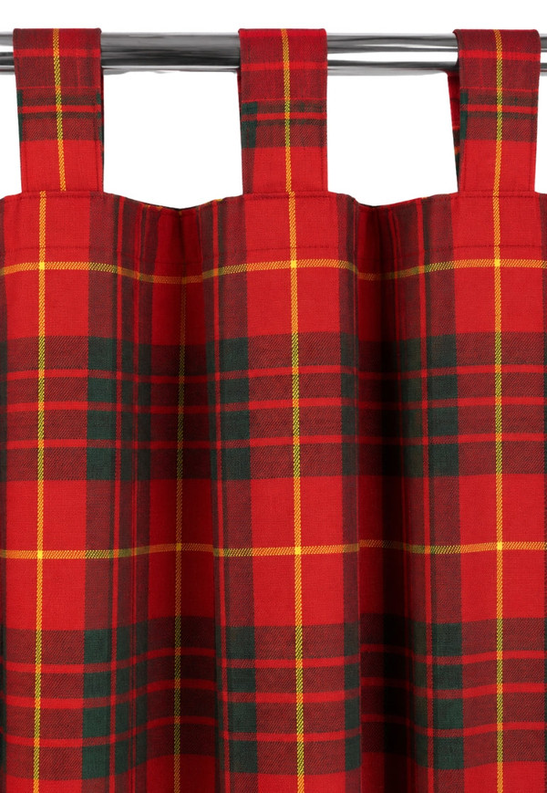 Red tartan tab top curtains with green and yellow lines hanging on a metal rod