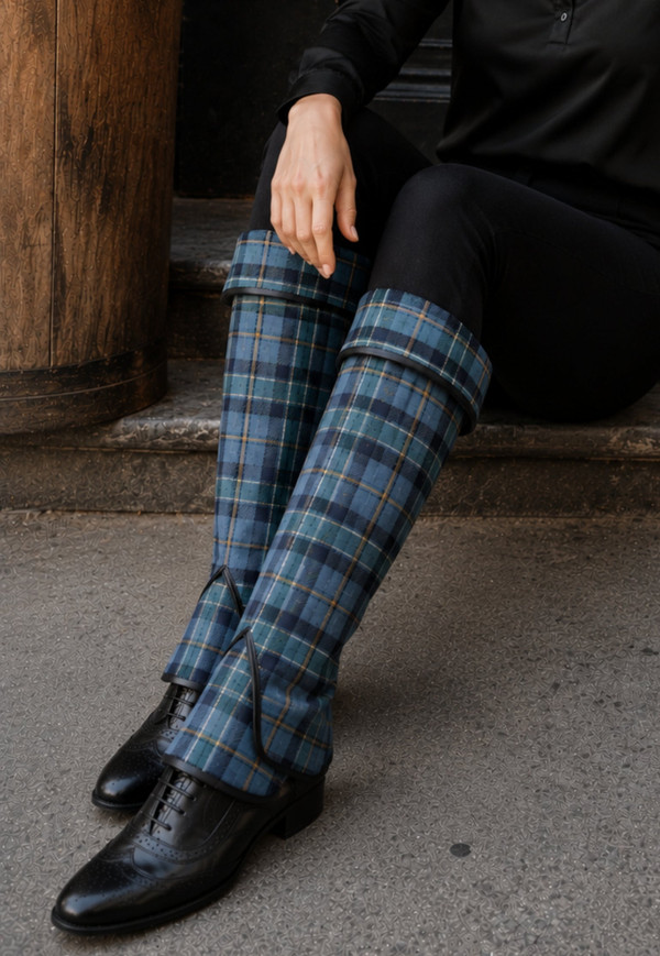 Blue tartan spats worn over black brogues, seated close-up