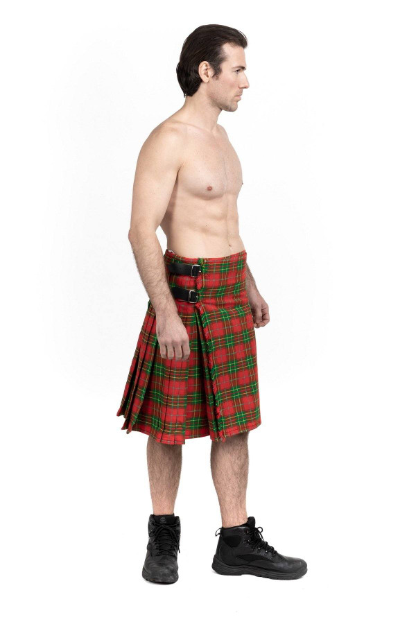 Side view of man in red and green Burnett tartan kilt with leather straps