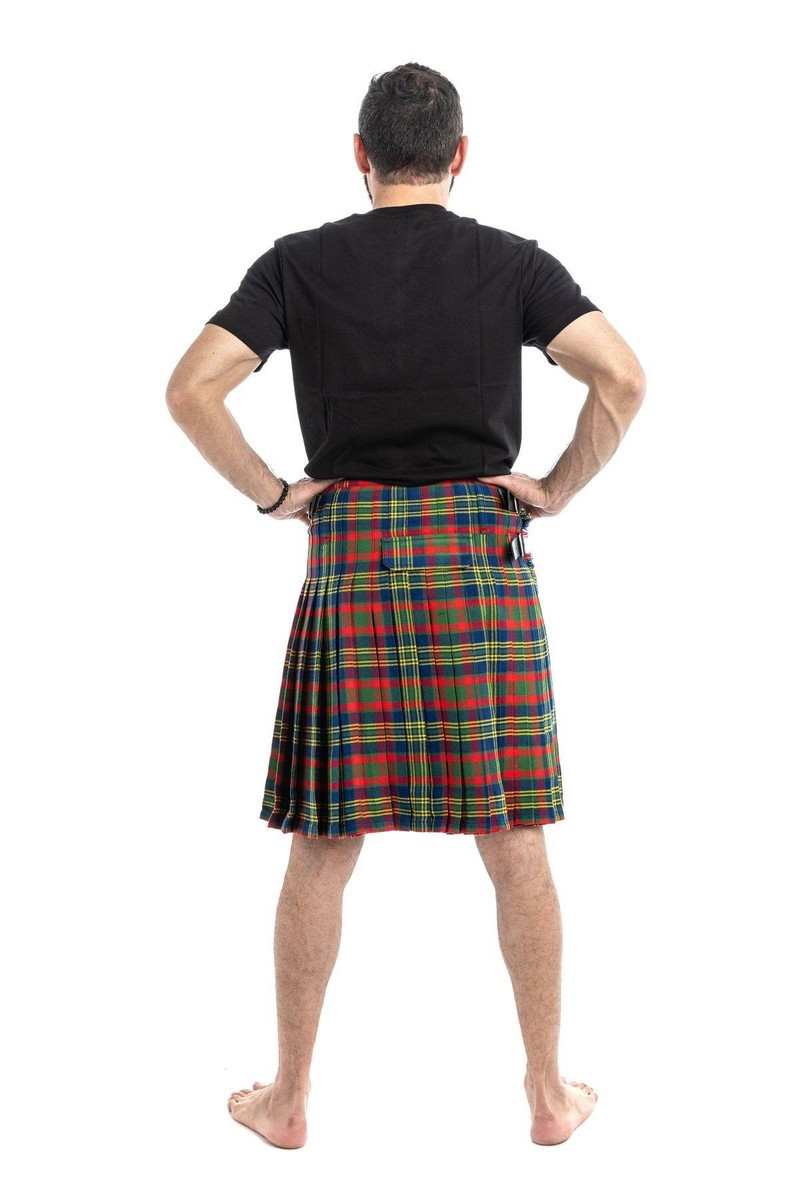 Man wearing a bespoke kilt in dark green and navy tartan, back view showing pleats