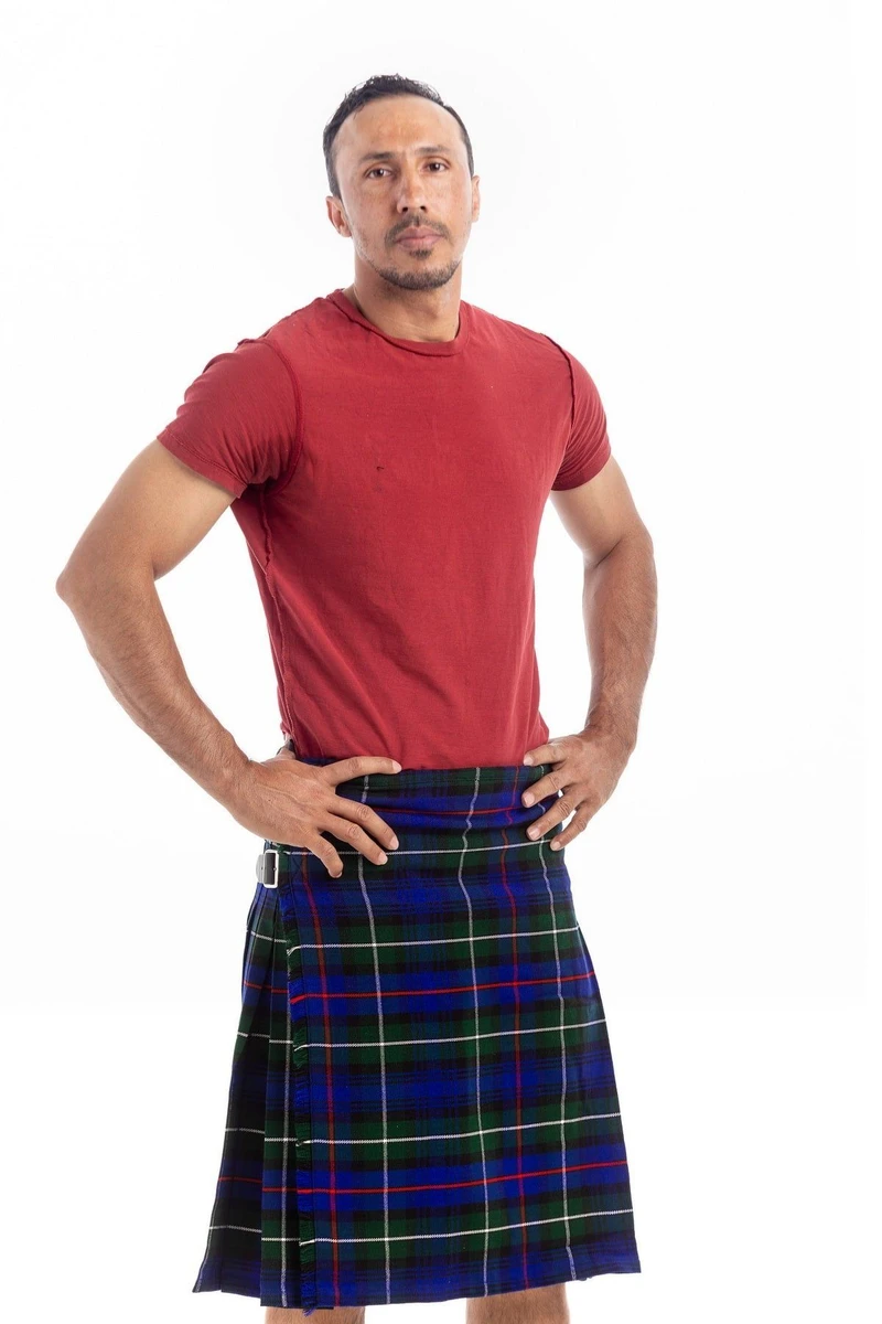 Man in navy, blue and green tartan kilt with red T-shirt, three-quarter view