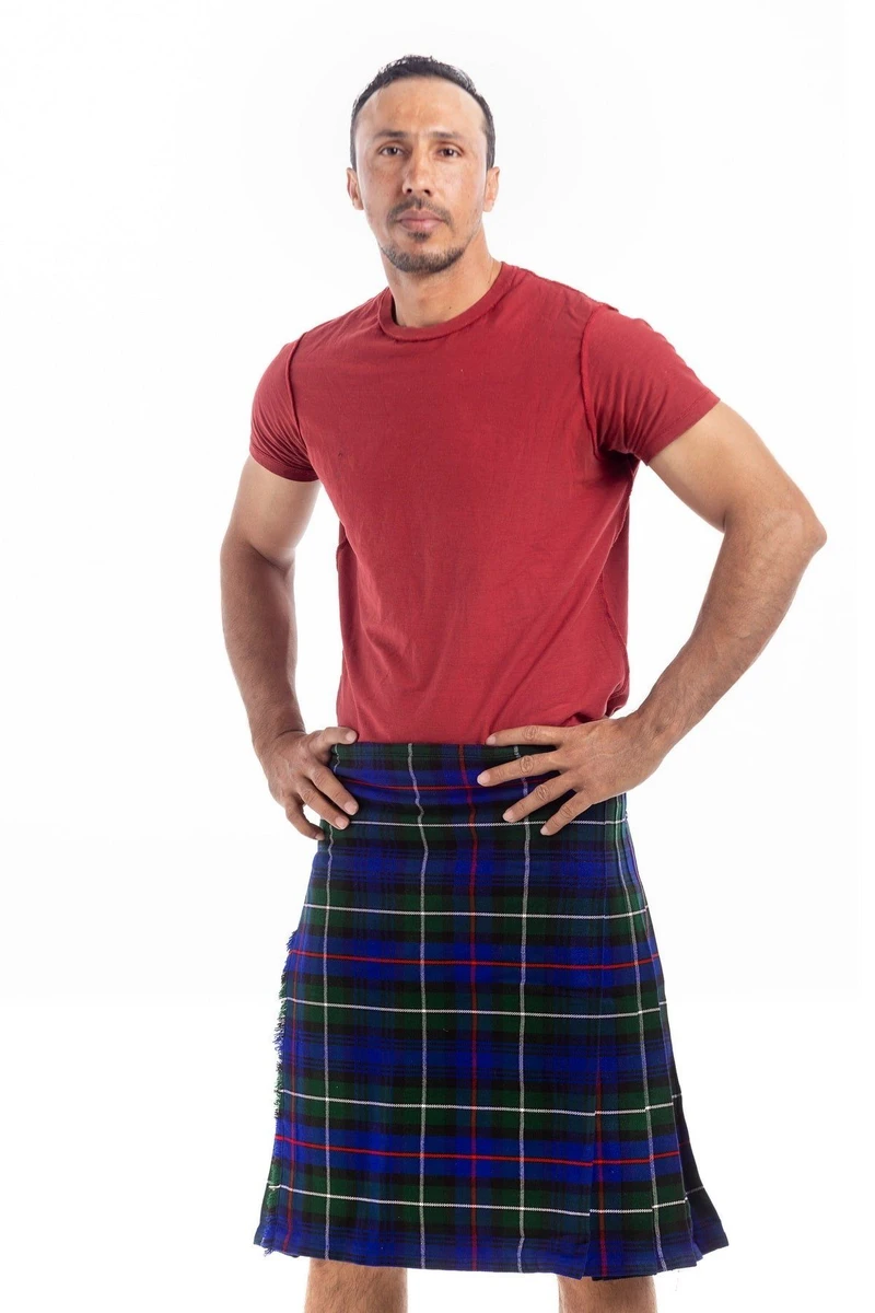 Straight-on front view of navy and blue tartan kilt with hands on hips