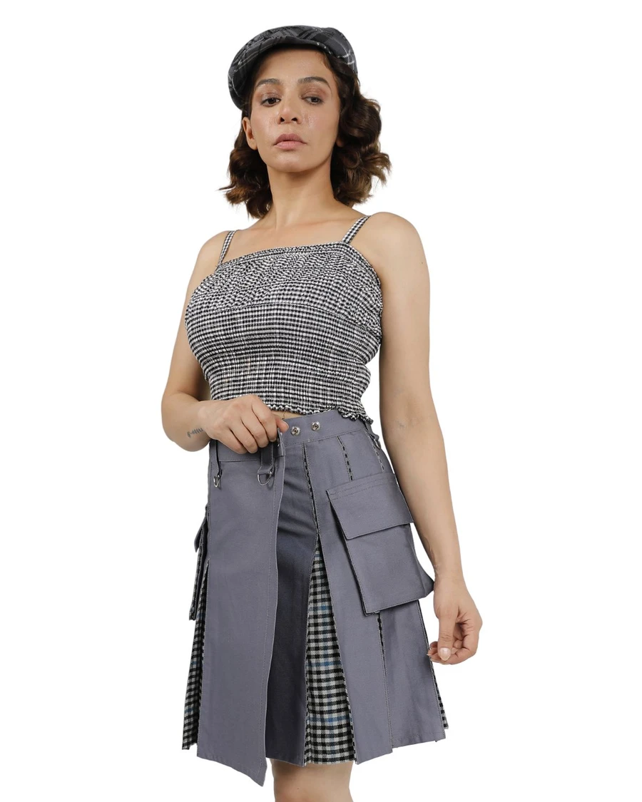 Woman in grey hybrid kilt with gingham pleats and cargo pocket, front view