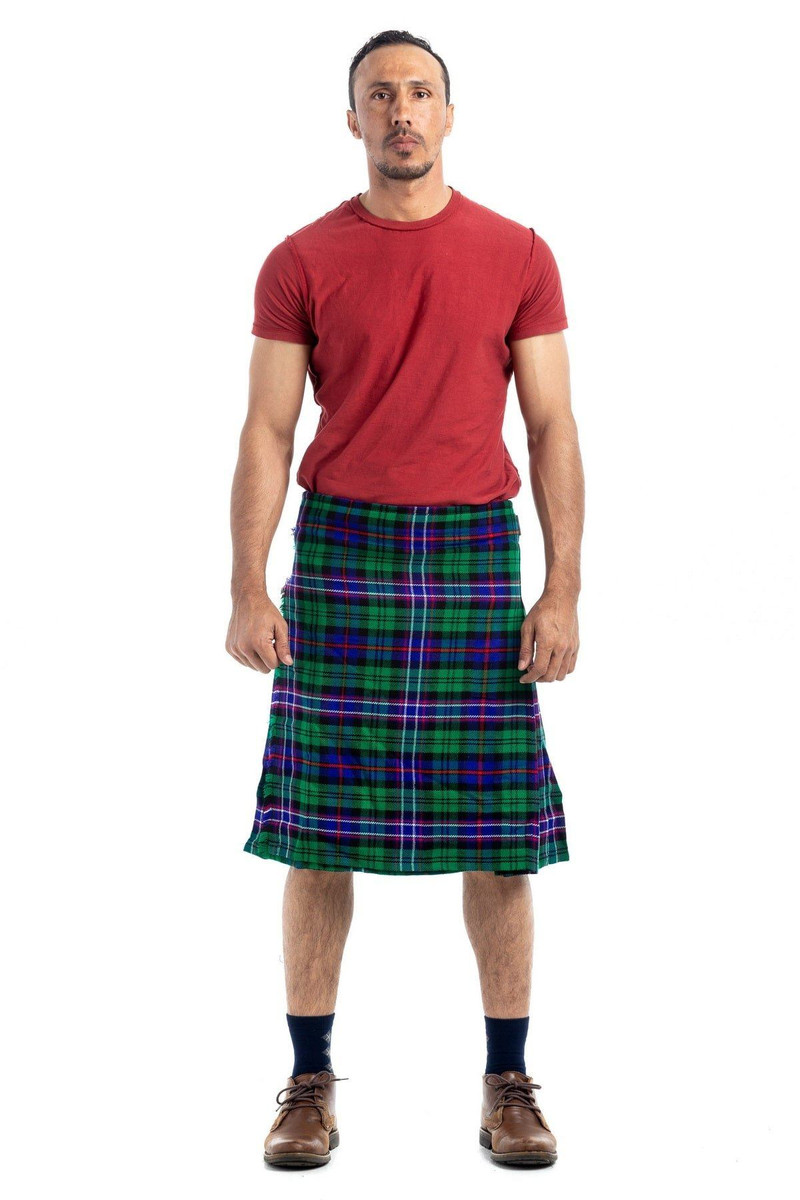 Man wearing a modern bespoke kilt in grey mottled fabric with side straps, front view