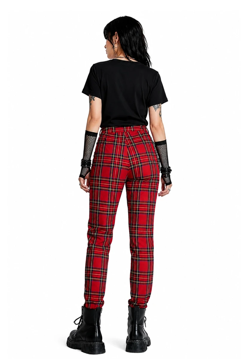 Back view of woman in red tartan punk zipper trousers with black boots
