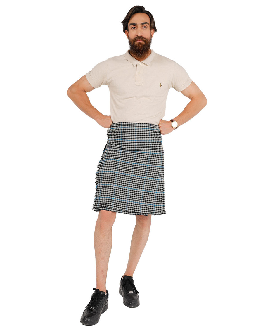 Front view of man in Haig Check bespoke kilt with beige polo and black shoes