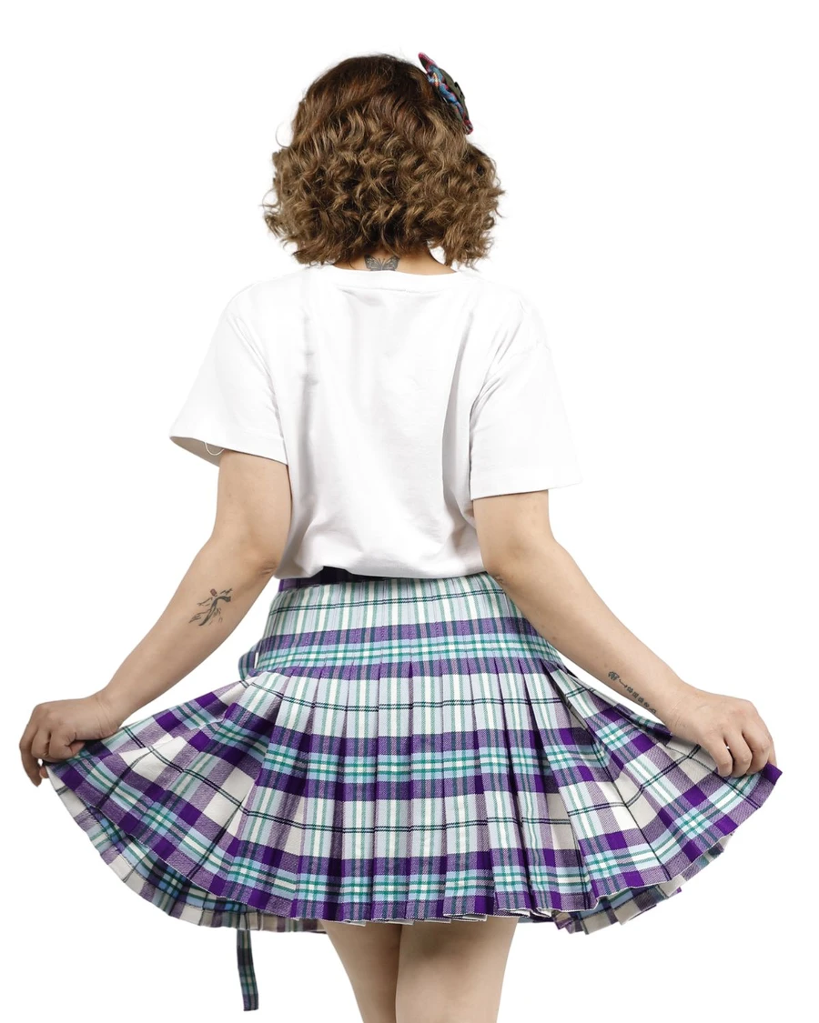 Back view of purple and white tartan pleated wrap skirt held out to show pleats