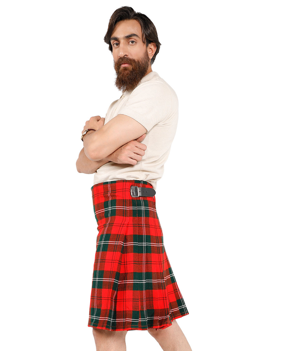 Man wearing a bespoke kilt in bright red and green tartan, side view with buckle strap