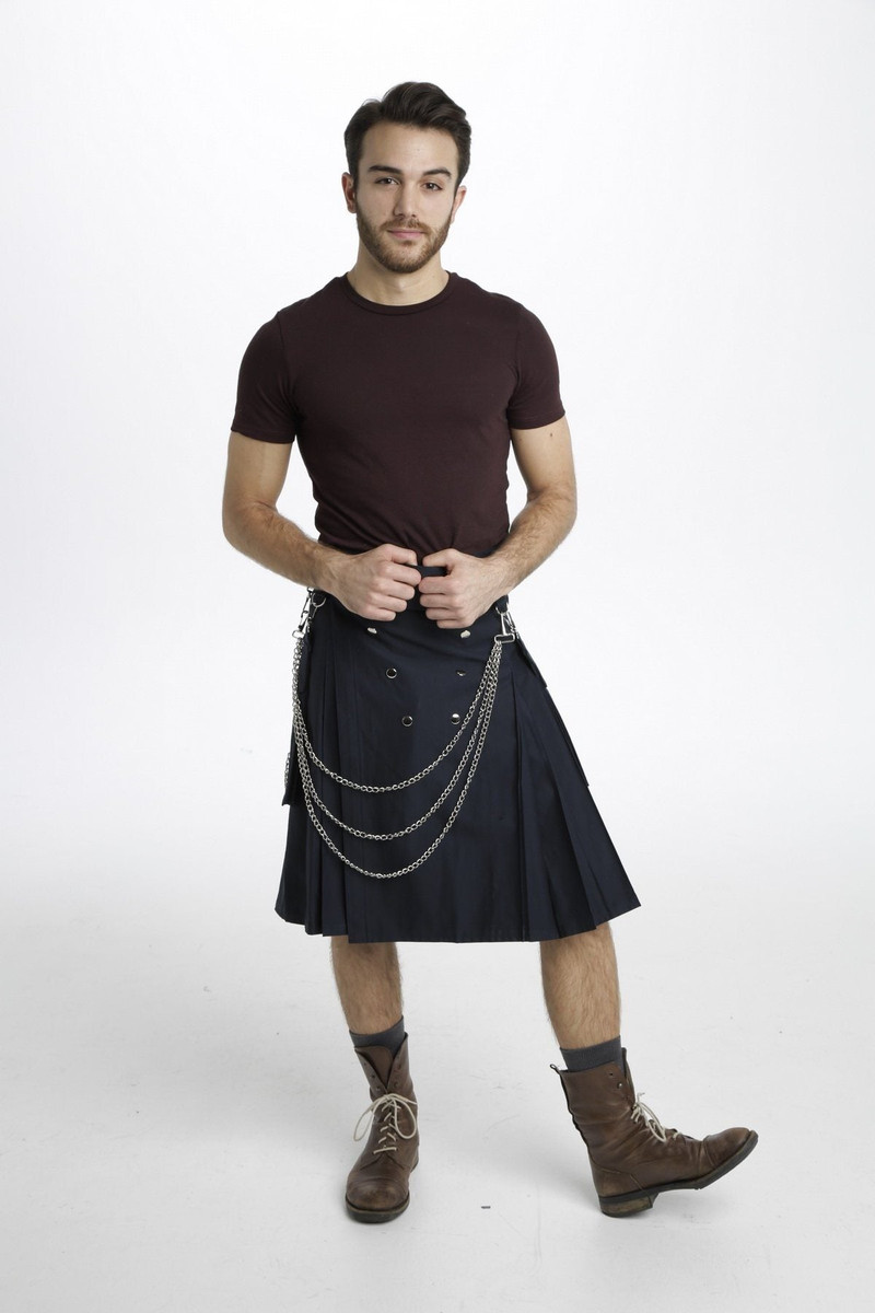 Man in black Luxe Utility Kilt with snap pockets and silver chains, front view