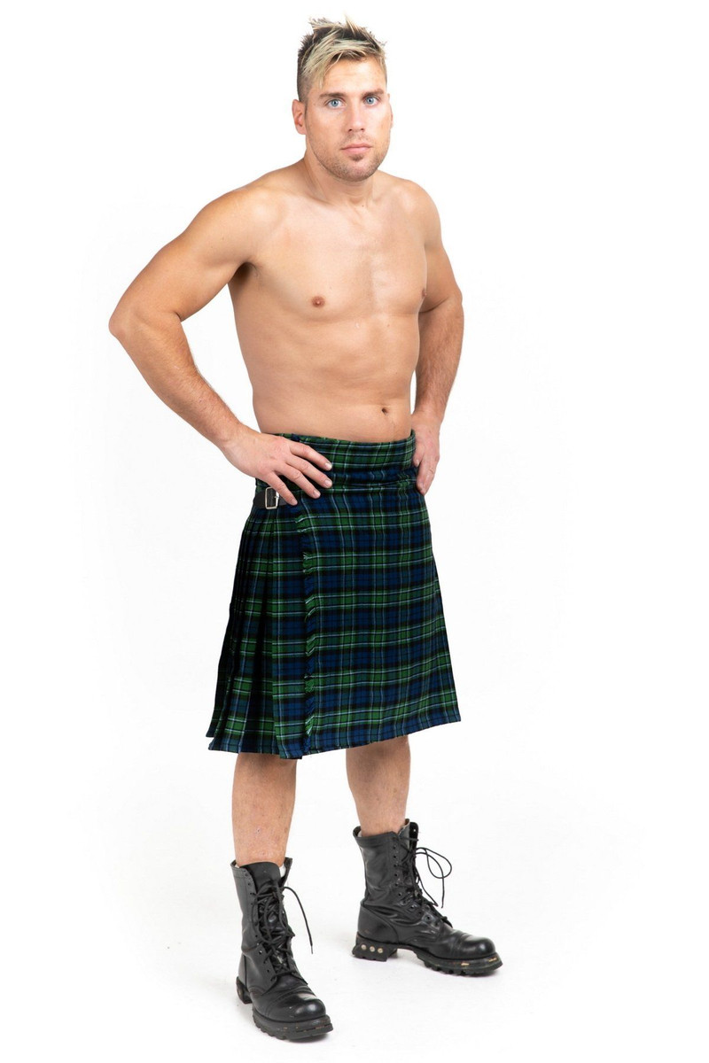 Man in MacCallum bespoke kilt in green and blue tartan with combat boots