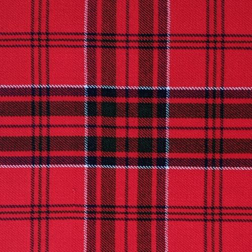 Close-up of navy and green tartan fabric with red and white lines for a bespoke kilt