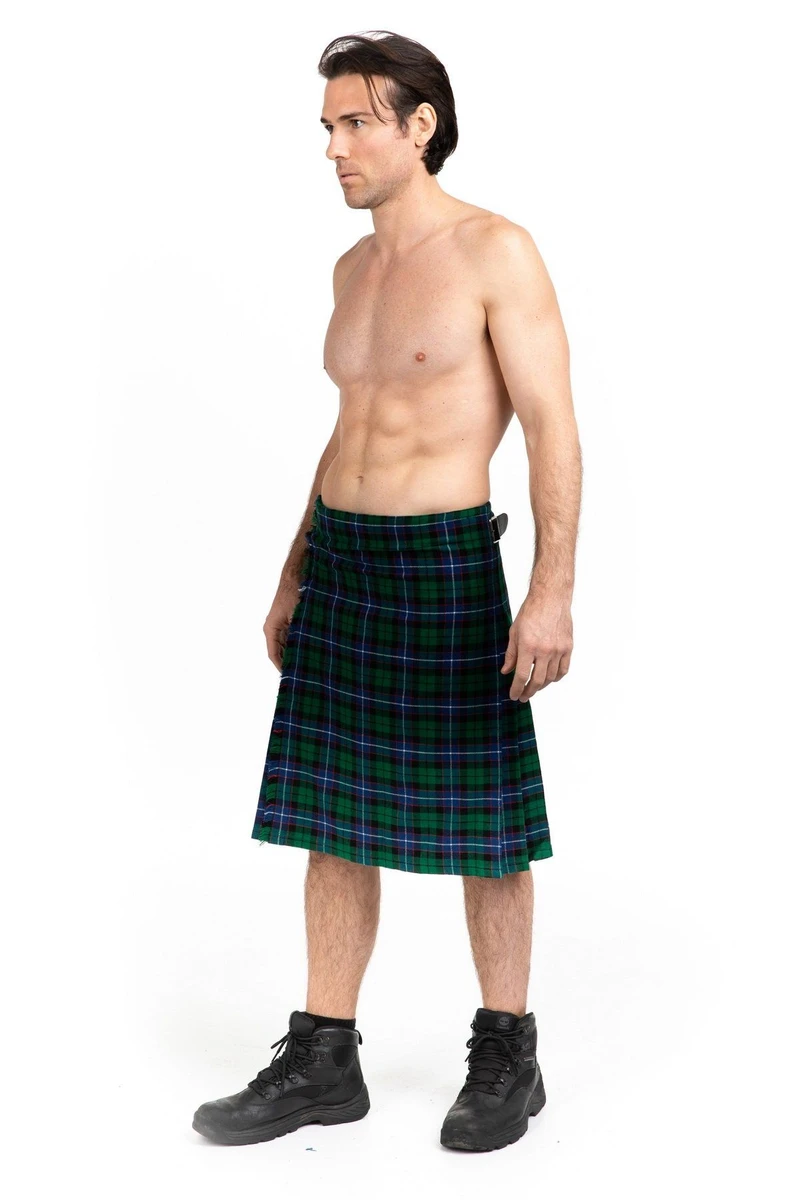 Man in Mitchell tartan kilt and black boots, three-quarter side view
