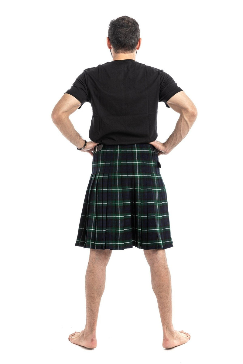 Man wearing a bespoke kilt in dark green and black tartan with white lines, back view