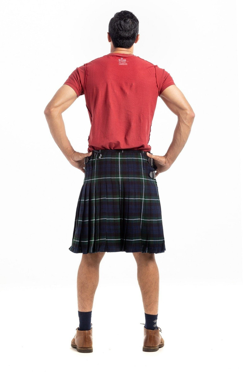 Bespoke kilt in dark navy and green tartan worn by a man, back view