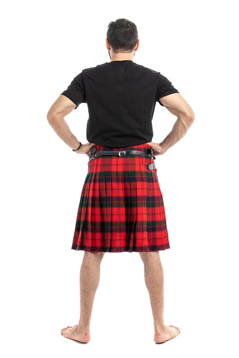 Man wearing a bespoke kilt in red and black tartan, back view showing pleats and straps