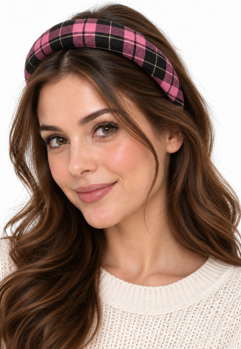 Smiling woman wearing a padded headband in pink and black tartan